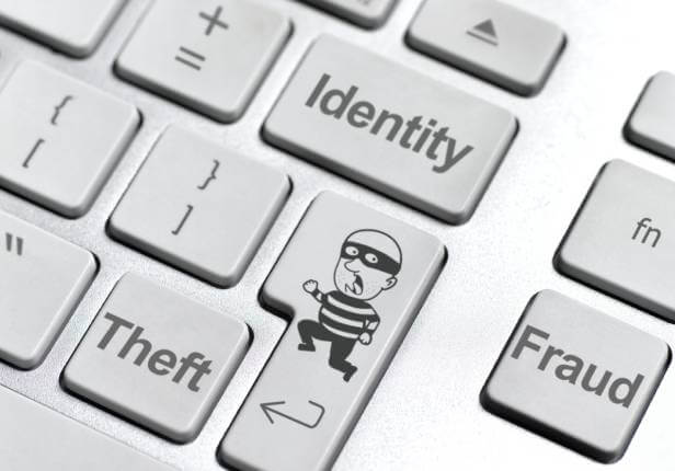 Identity Theft and Fraud written on keyboard keys.